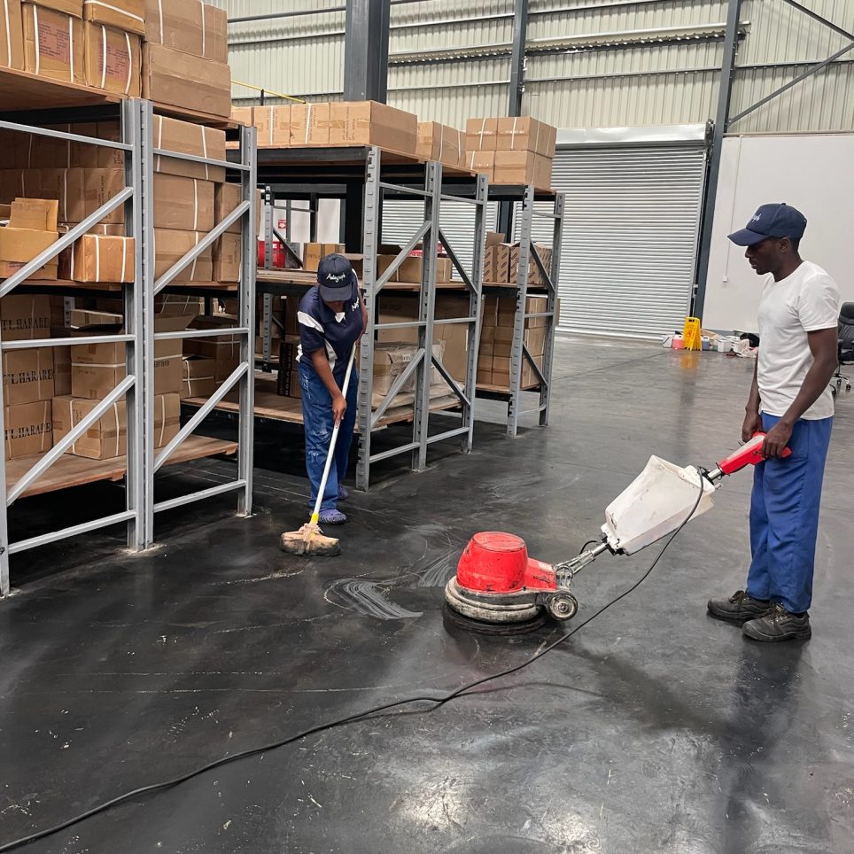 IMG_6079 Professional cleaners cleaning and reorganizing a warehouse.